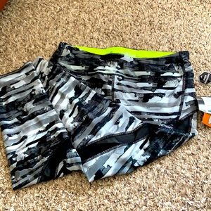 Patterned Capri leggings with neon inside.